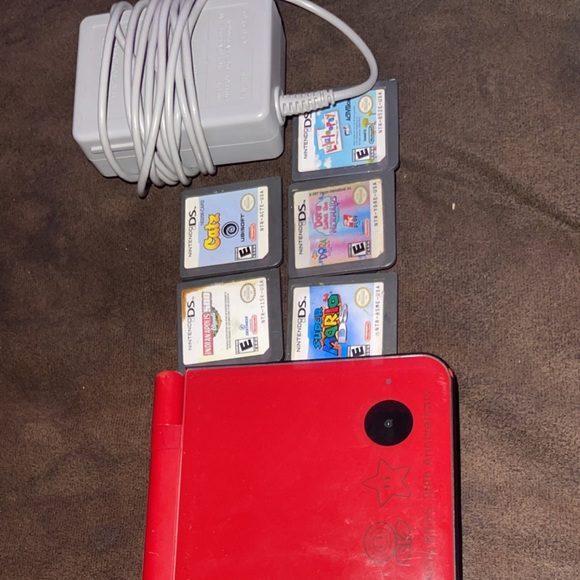 Nintendo DS XL for sell , games and charger included!